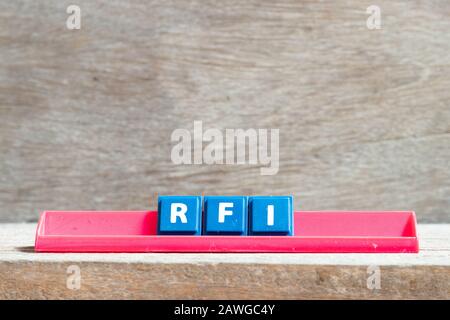 Tile letter on red rack in word RFI (Abbreviation of request for information) on wood background Stock Photo