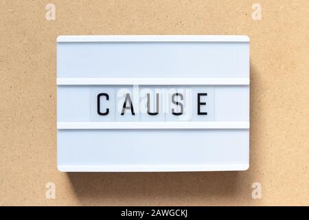 White lightbox with word cause on wood background Stock Photo