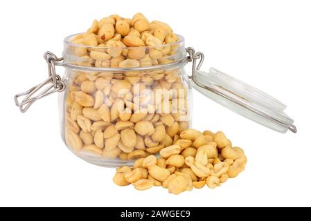 Roasted peanuts in a glass storage jar isolated on a white background Stock Photo