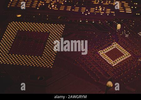 Processor pins macro. computer motherboard close up. cpu pins on a circuit board. micro elements of computer central processor unit. modern technologi Stock Photo