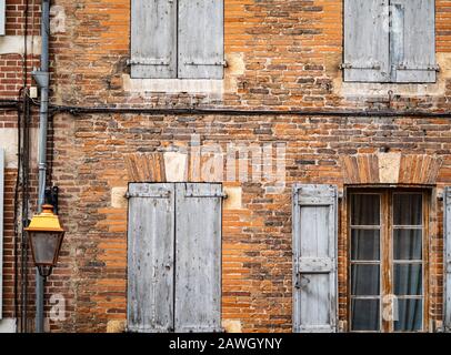 One Window With Open Shutters In A Brick Wall Stock Photo