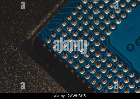 Processor pins macro. computer motherboard close up. cpu pins on a circuit board. micro elements of computer central processor unit. modern technologi Stock Photo