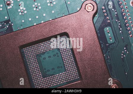 Processor pins macro. computer motherboard close up. cpu pins on a circuit board. micro elements of computer central processor unit. modern technologi Stock Photo