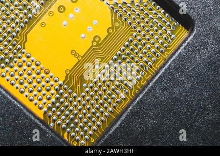 Processor pins macro. computer motherboard close up. cpu pins on a circuit board. micro elements of computer central processor unit. modern technologi Stock Photo