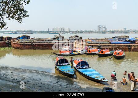 Traditional wooden fishing boats in river Hooghly or Ganga in Kolkata. India Stock Photo