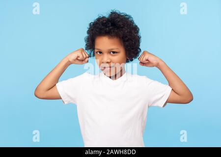 Strong Little Caucasian Boy in White Tank Top Showing Muscles with Smile on  His Face Stock Photo - Image of muscle, hand: 150194988