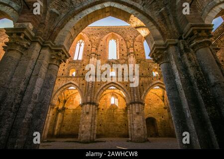 One of the remaining walls framed in an arch in the former Cistercian Abbey - San Galgano Tuscany Italy Stock Photo