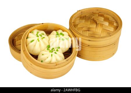 Steamed bao buns in bamboo steamers isolated on a white background Stock Photo