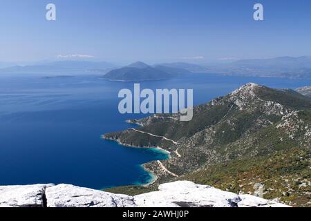 The entrance to the Pagasetic Gulf and snow-covered mountains in the distance from Tiseo mountain, South Pelion, Greece