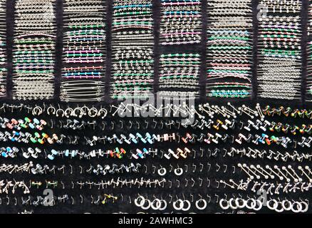 Boracay, Aklan Province, Philippines: Array of silver fashion jewelery souvenirs items for sale orderly displayed on a black cloth Stock Photo