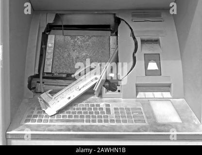 broken ATM machine following a robbery in black and white Stock Photo