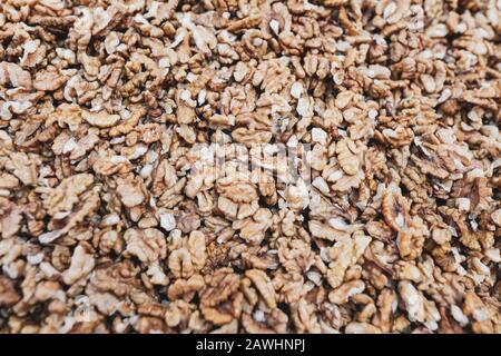 Shallow depth of field (selective focus) image with walnut kernels piled together. Stock Photo