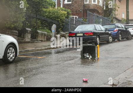 Sydney. 9th Feb, 2020. Photo taken on Feb. 9, 2020 shows a street in heavy rain in Sydney, Australia. A huge rainfall hits Australia's bushfire-ravaged east coast on Friday. In the midst of the worst drought on record, the huge rainfall on Friday is predicted to stick around for at least a week and may bring relief to the long-suffering communities. Although the rain is mostly being seen as good news, authorities are also warning that fire-damaged areas are at extreme risk of flooding. Credit: Bai Xuefei/Xinhua/Alamy Live News Stock Photo