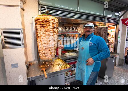 ISTANBUL - JAN 02: Man Seller making traditional Turkish Dish Durum or Kebab in the Street of Istanbul on January 02. 2020 in Turkey Stock Photo