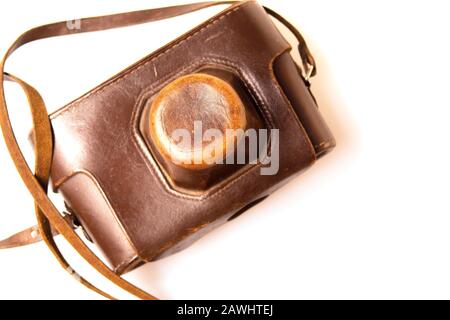 Old camera in brown leather case Stock Photo