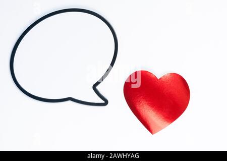 Shiny red heart with a blank speech bubble for Valentine's Day message on white background Stock Photo