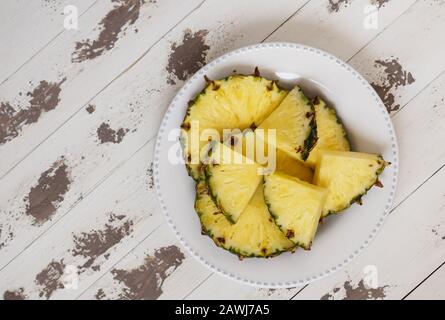 fresh pineapple cutted on the old painted  white wood Stock Photo