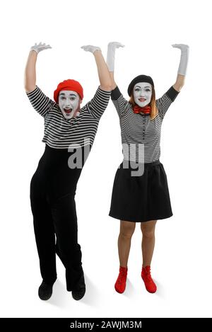 Smiling mimes holding something heavy. Illusions and funny acting Stock Photo