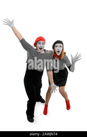 Two mimes are having fun. Vertical full length portrait of man and woman Stock Photo