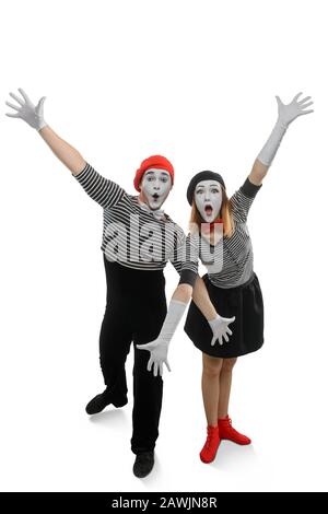 Portrait of two happy mimes posing with arms wide open Stock Photo