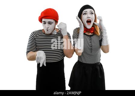 Mimes talking on the phone. Man dials a woman's number Stock Photo