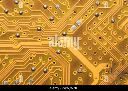 Burnt circuit board abstract background. spoiled motherboard close up. micro elements of computer. Intelligent technology Stock Photo