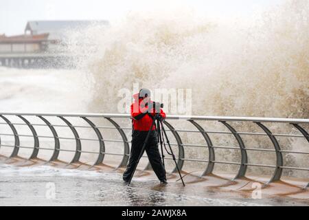 Blackpool, Lancashire. 9th Feb, 2020. The third named storm of the season, the worst since 2013 arrives in Blackpool. Large waves and debris thrown on coastal roads, seafronts and properties present a risk to life. Wet and windy weather, with winds as strong as 60mph going up to 70mph in more exposed areas. Credit: MediaWorldImages/Alamy Live News Stock Photo