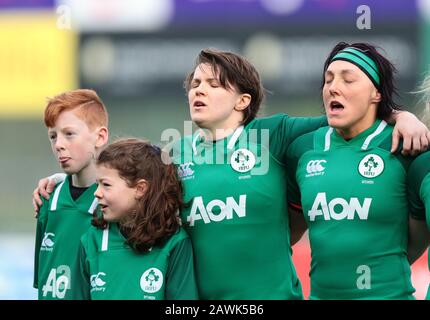 Energia Park, Dublin, Leinster, Ireland. 9th Feb, 2020. International Womens Rugby, Six Nations, Ireland versus Wales; Ciara Griffin (Ireland) and Lindsay Peat (Ireland) sing the national anthem before kickoff, with the two mascots Credit: Action Plus Sports/Alamy Live News Stock Photo