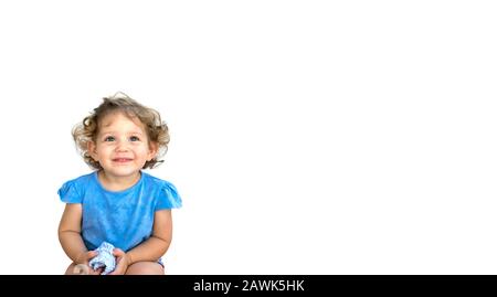 Cute smiling little girl looking thoughtful isolated against a pure white background Stock Photo