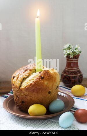 Traditional easter cake and colored eggs - easter still life. Rustic style. Stock Photo