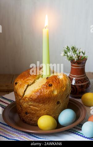 Traditional easter cake and colored eggs - easter still life. Rustic style. Stock Photo