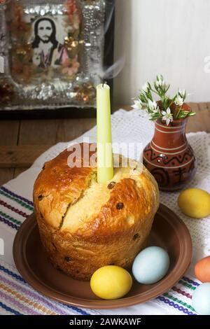 Traditional easter cake and colored eggs - easter still life. Rustic style. Stock Photo