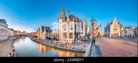 Ghent, Belgium,circa August 2019. Panoramic view of the Graslei, quay in the promenade next to river Lys in Ghent, Belgium and St Michael's Bridge at Stock Photo