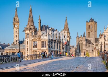 Ghent, Belgium,circa August 2019. Panoramic view of the Graslei, quay in the promenade next to river Lys in Ghent, Belgium and St Michael's Bridge at Stock Photo