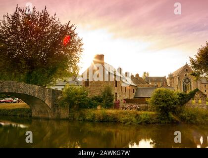 Image of the canal and bridge at sunset at Lehon, Brittany France Stock Photo