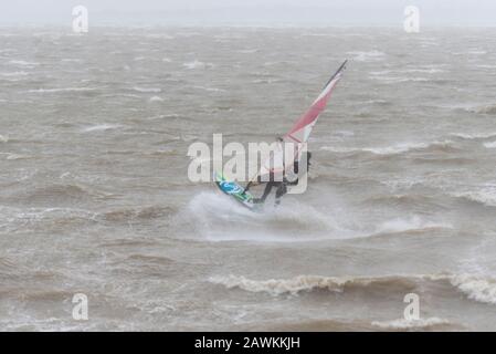 Southend on Sea, Essex, UK. 9th Feb, 2020. An amber weather warning has been issued for much of the UK as Storm Ciara passes across. It hasn't deterred people from taking to the water for windsurfing Stock Photo