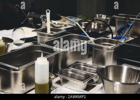 Stainless steel cooking containers in a professional kitchen Stock Photo