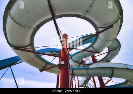 View from below a water slide looking up through the built structure Stock Photo