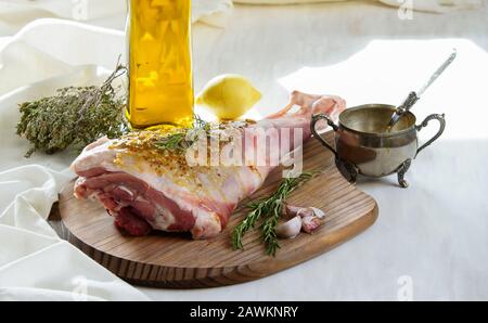 lamb leg raw with olive oil and mustard seeds marinade Stock Photo