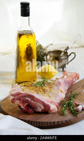 lamb leg raw with olive oil and mustard seeds marinade Stock Photo