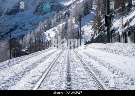 Train tracks running up the mountains In Chamonix France Stock Photo