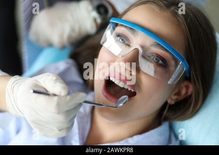 Girl feels comfortable at dental examination. Stock Photo