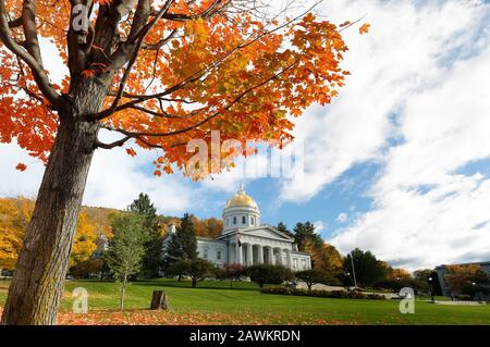 The Vermont State House with Colorful Foliage in Background.  Located in Montpelier, the house is the state capitol of Vermont, in the United States. Stock Photo