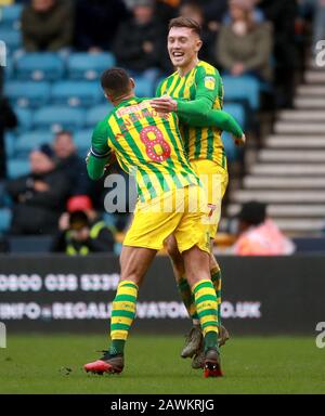 West Bromwich Albion's Dara O'Shea (right) celebrates scoring his side's second goal of the game with team mate Jake Livermore during the Sky Bet Championship match at The Den, London. Stock Photo
