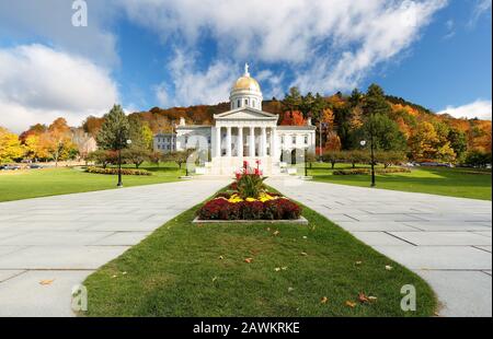 The Vermont State House with Colorful Foliage in Background.  Located in Montpelier, the house is the state capitol of Vermont, in the United States. Stock Photo