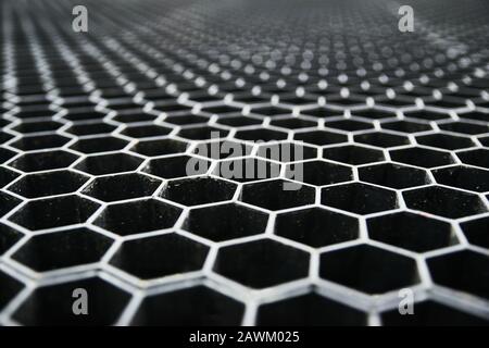 Hexagonal geometric shapes wallpaper, honeycomb pattern texture, metal grid background. Abstract decoration design element, seamless pattern. Technica Stock Photo