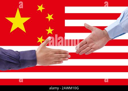 businessmen handshaking on Usa or American and China flags merged relationship concept. Stock Photo