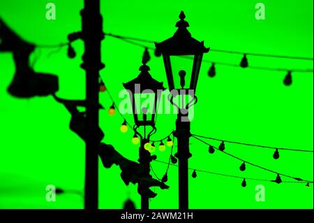 Light bulbs and street lamps at dusk as lights start to come on in St Annes,UK Stock Photo