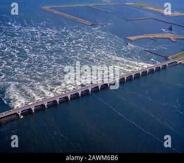 Deltawerken, Holland, May 27  - 1990: Historical aerial photo of the Deltawerken, one of the Seven Wonders of the Modern World, in Zuid Holland and Ze Stock Photo