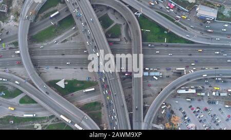 Top Down View Overpass Road Day Traffic in Kiev. Aerial Shot of Highway with Cars and Trucks. Drone Flight over Ukraine Capital Two Level Junction. Big City Sight Stock Photo